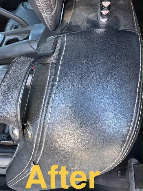 The same black leather armrest after the seam repair and refinishing