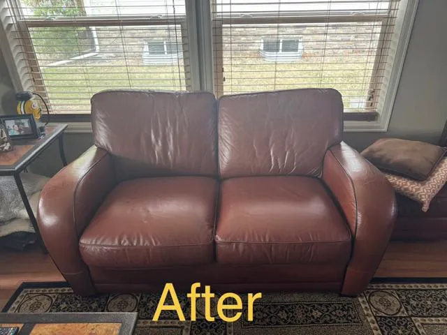 The same loveseat after restoration, with evenly colored brown seat cushions