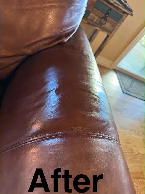 The same brown leather armrest after repair, with an even color and sheen