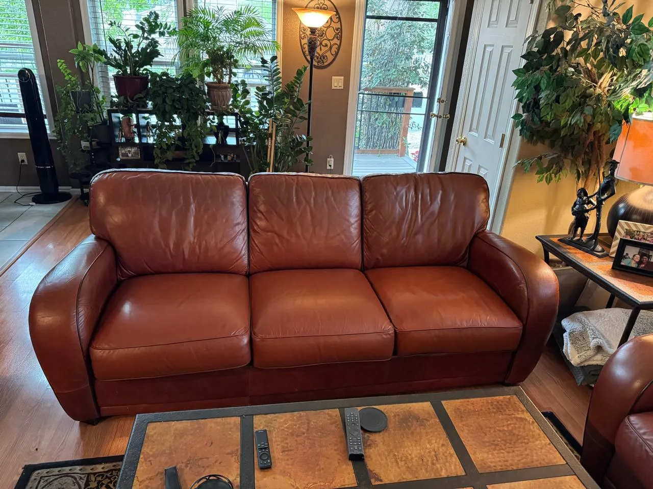 Restored brown leather sofa in a living room