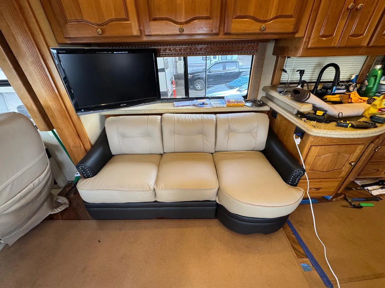 Cream and black two-tone sofa inside an RV